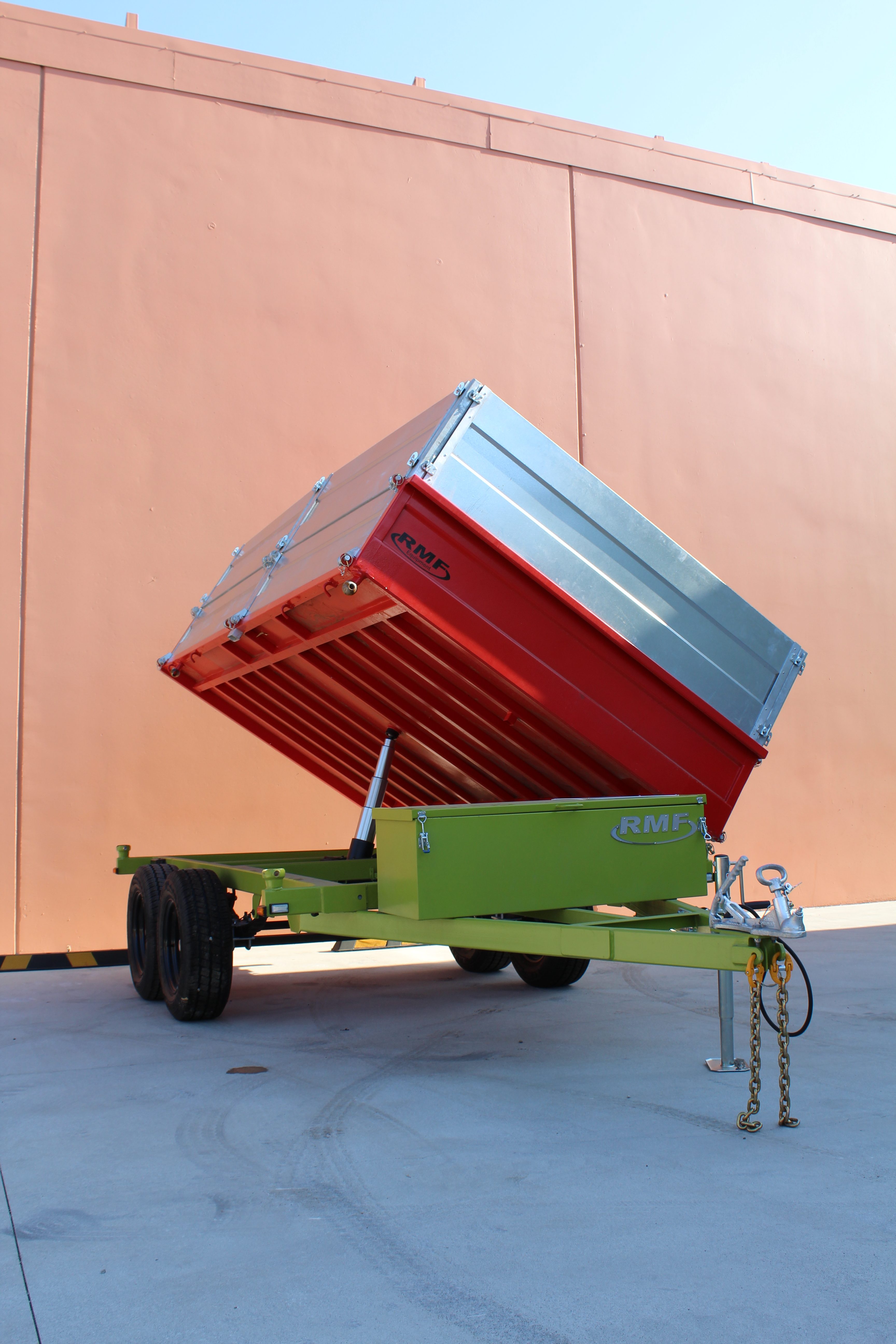 RMF three-way tipper trailer with its body raised